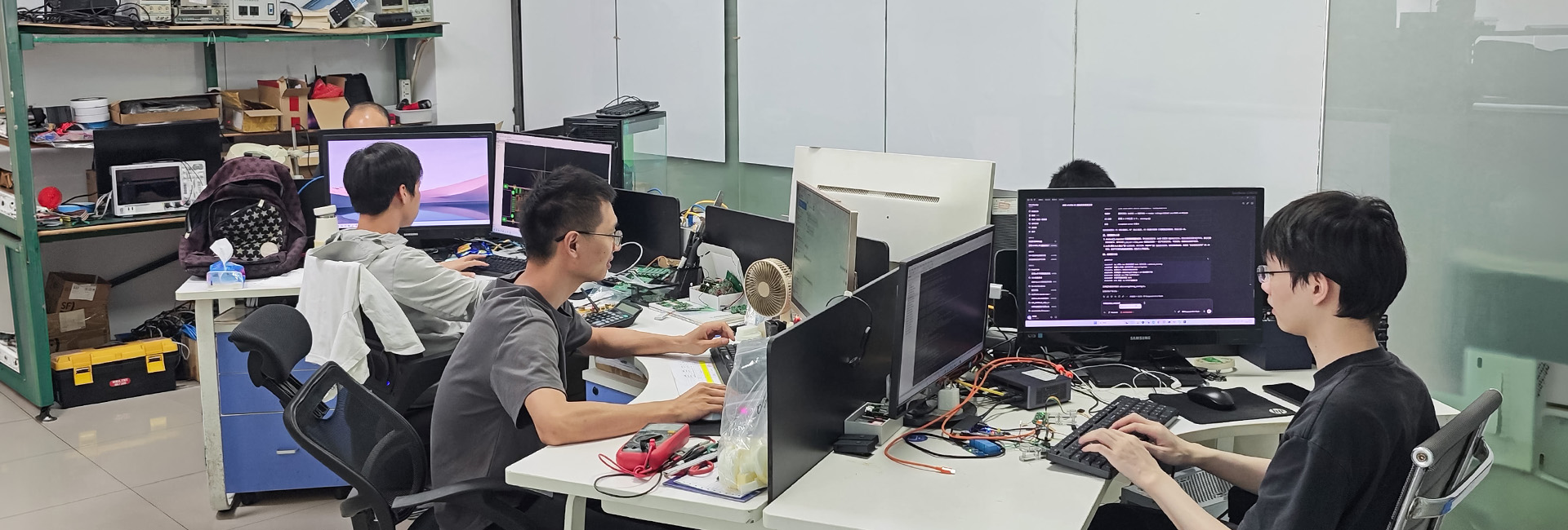 Engineers working at their desks in GMIC's Shenzhen engineering office