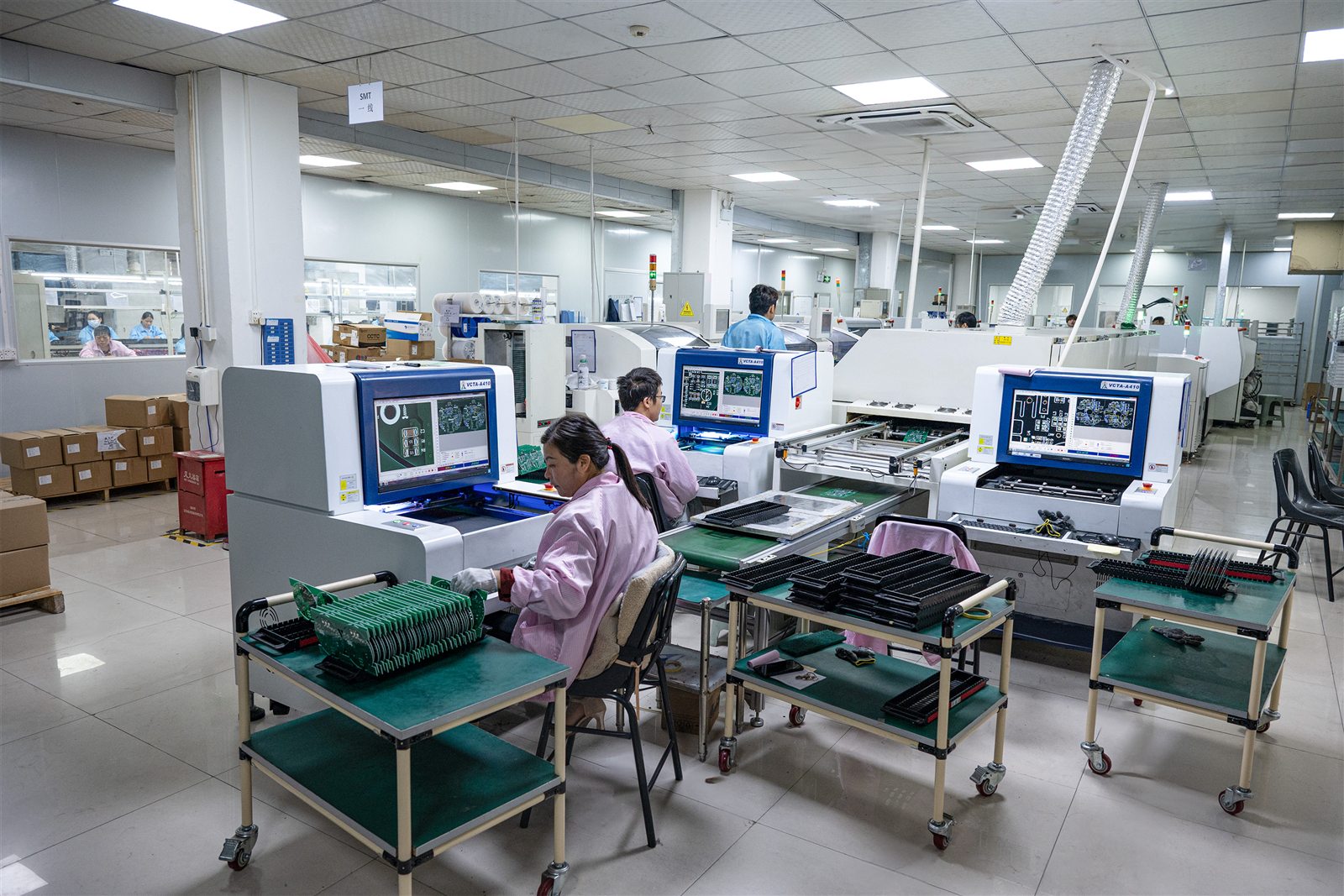 Row of automated inspection machines on the GMIC line